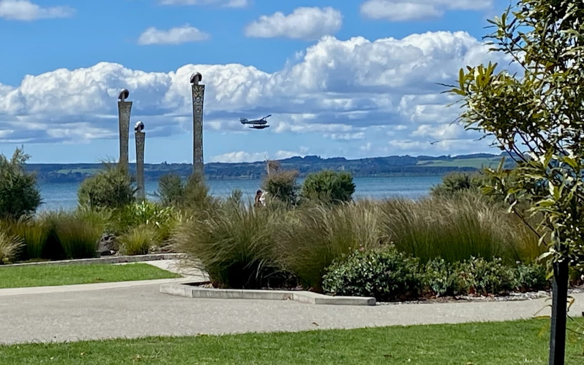 Lakefront Pou Tumu and Volanic Air floatplane flying past