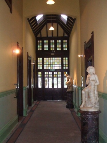 Rotorua Museum corridor with a couple of the sculptures shown