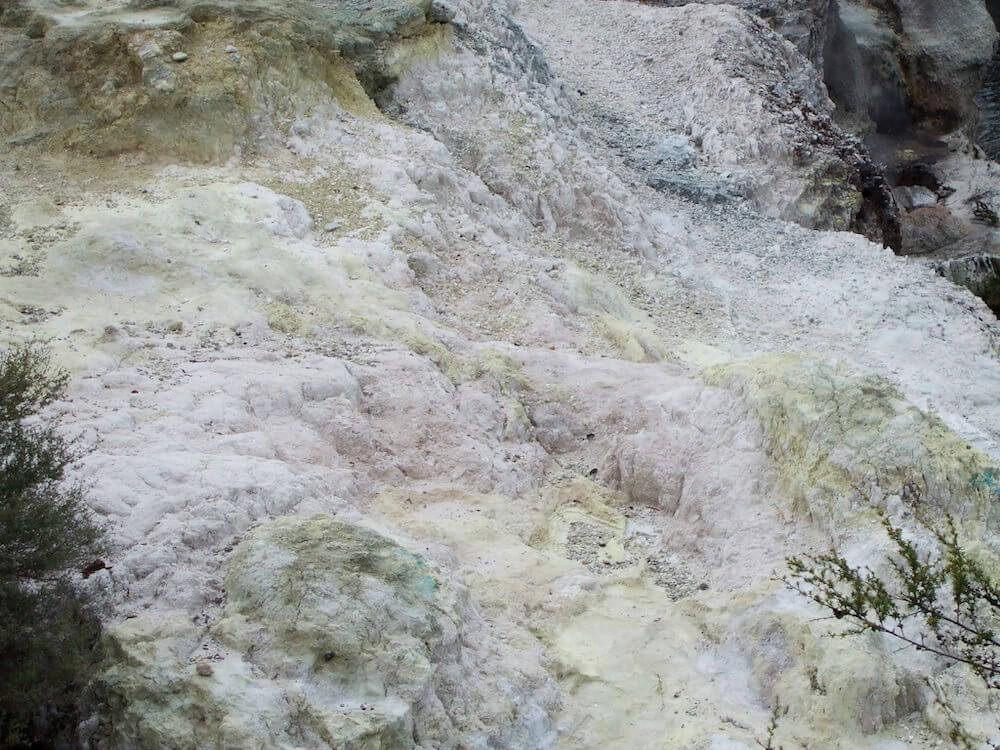 Whakarewarewa Thermal Village silica rocks coloured white and yellow. Whakarewarewa Thermal Village silica rocks