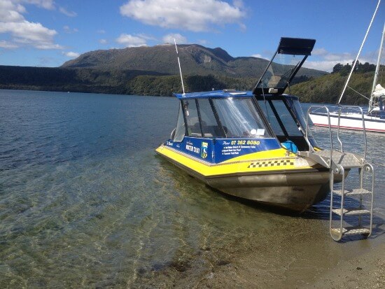 Lake Tarawera Water Taxi with Mt Tarawera as a backdrop