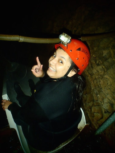 Waitomo Black Water Rafting - Elise at the top of the slide