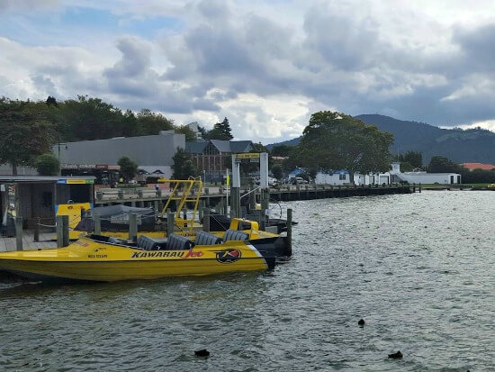 A Katoa jet boat at anchor. That's Mt Ngongotaha to the right.