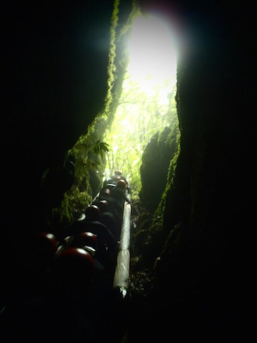 Ascending out of Footwhistle Cave, Waitomo, New Zealand