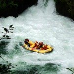 White water rafting Rotorua - Raft disappearing into the water